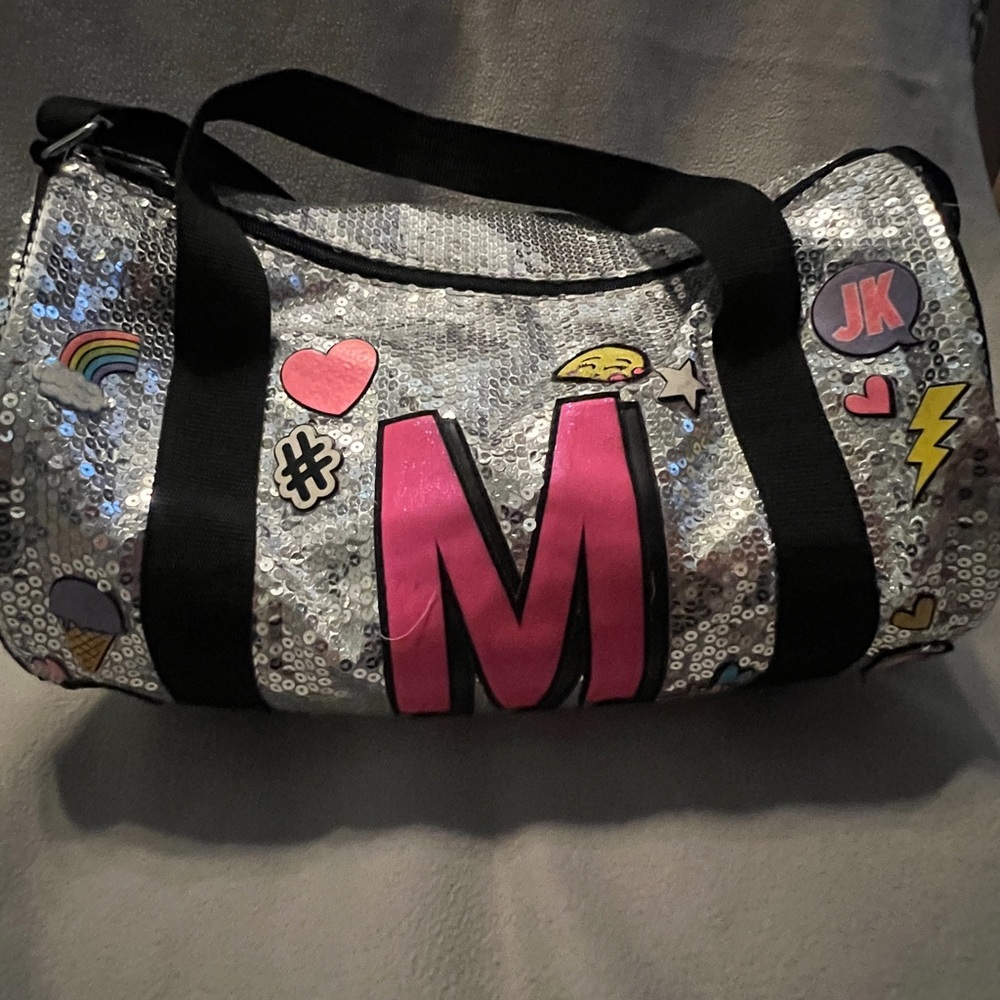 COPY - Silver sequin ‘M’ Justice overnight bag.
